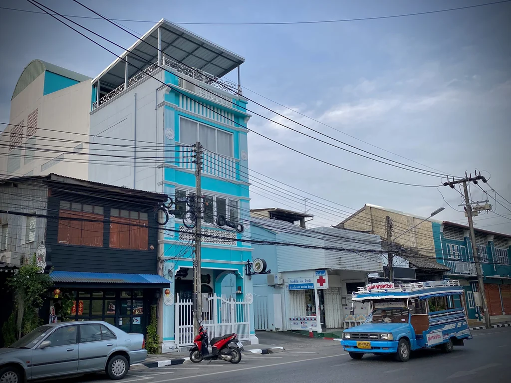 Blue local bus on a street in Phuket Town