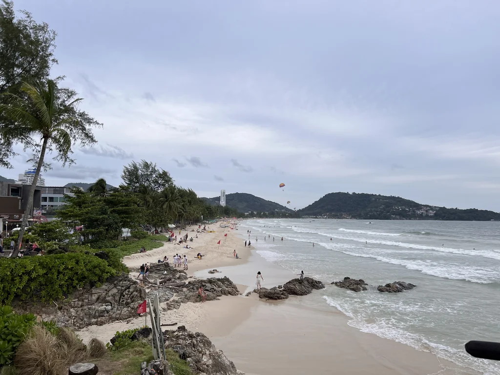Wide view along the sandy shoreline at Patong Beach, Phuket